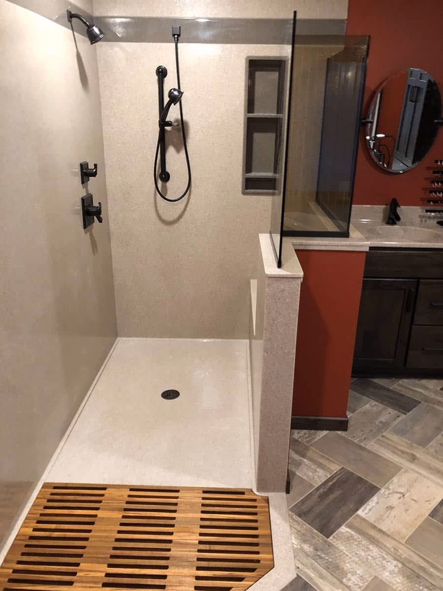 What are the disadvantages of Corian shower walls?